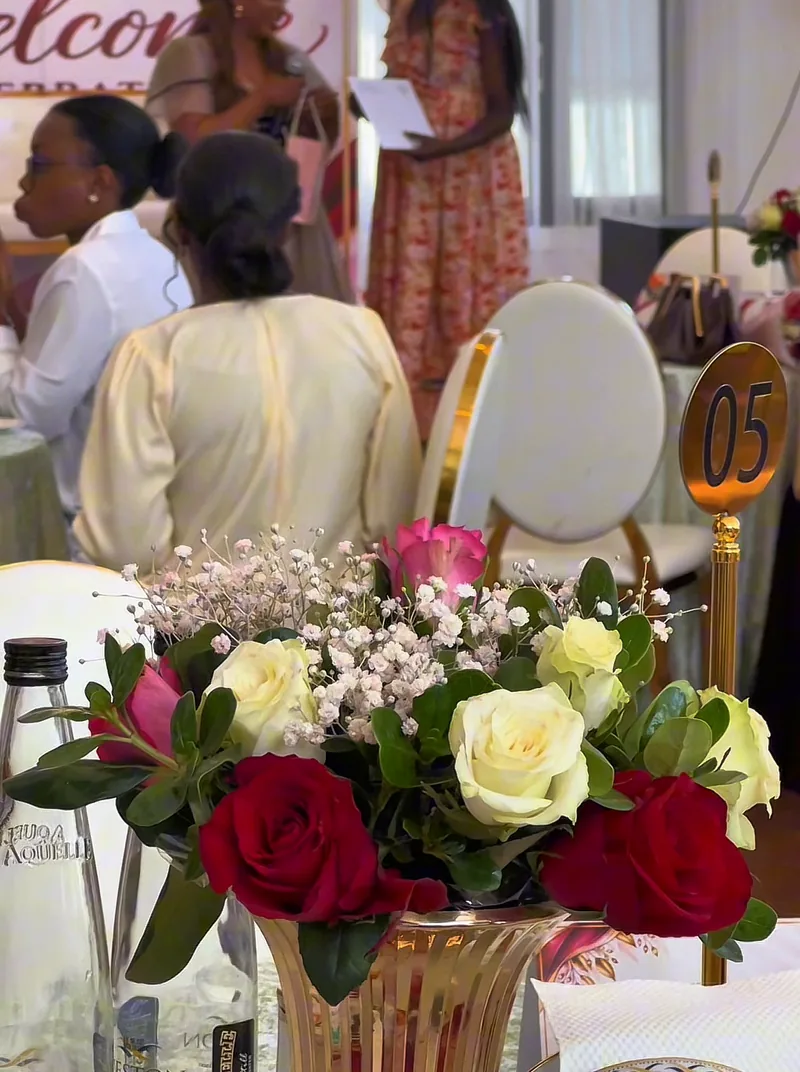 Event flowers on a table at the Celebrate Her event